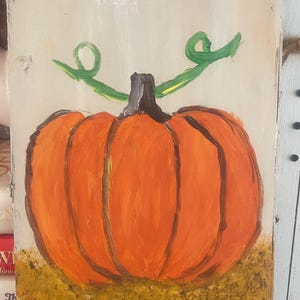Folkart Pumpkin crafted on 6x9 bark plank. Created with acrylic, paintbrush and sponge.