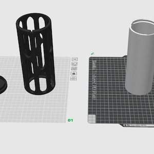 K&ouml;nnte beinhalten: Zwei 3D-gedruckte Modelle eines zylindrischen Beh&auml;lters mit Deckel. Der Beh&auml;lter links ist schwarz und hat ein Gitterdesign. Der Beh&auml;lter rechts ist grau und massiv.