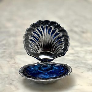 Antique shell butter dish in silver metal and blue glass, elegant decoration for breakfast table, antique object