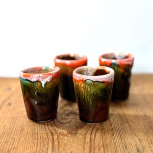 Set of 4 Vallauris glazed ceramic liqueur goblets, unique brown pieces with green, turquoise and orange &quot;lava&quot; patterns from the 70s