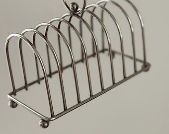 Vintage silver metal toast rack, elegant steel table decoration for refined breakfast, Letang Remy style, metal object