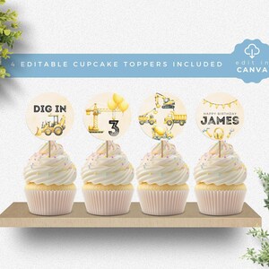 May include: Four round cupcake toppers featuring yellow construction vehicles, the number 3, and the text "DIG IN" and "HAPPY BIRTHDAY JAMES". Each topper is attached to a wooden pick and inserted into a white frosted cupcake on a wooden shelf.