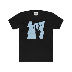 May include: Black t-shirt with a light blue graphic of a peace sign and the word "TWO" in bold letters.