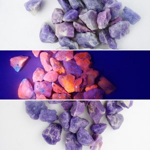 May include: A collection of purple and orange crystals. The crystals are arranged in a random pattern. The crystals are smooth and shiny.