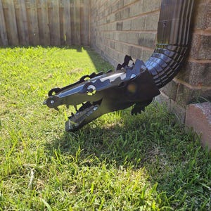 Crocodile downspout gutter decor