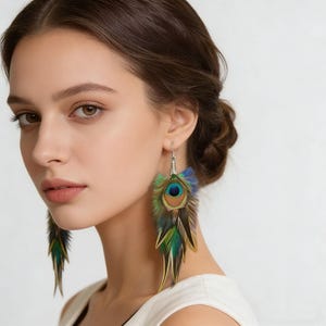 May include: Peacock feather earrings with a silver hook. The earrings feature a vibrant array of colours, including blue, green, and brown, mimicking the natural beauty of peacock feathers. The earrings are designed to dangle.