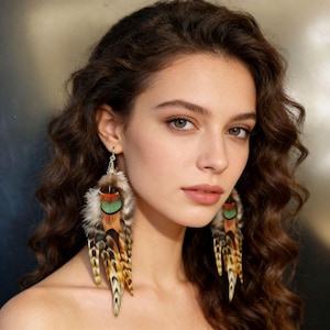 May include: Feather earrings with a mix of brown, tan, green, and orange feathers. The earrings have a silver hook and are long and dangling. The feathers have a natural, textured appearance, creating a bohemian style.