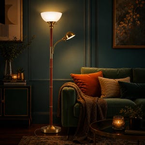 May include: A floor lamp with a dark wood and brass finish, featuring an upward-facing white glass bowl shade and an adjustable side reading light. The lamp has a circular brass base and a tall, slender pole with brass accents throughout.