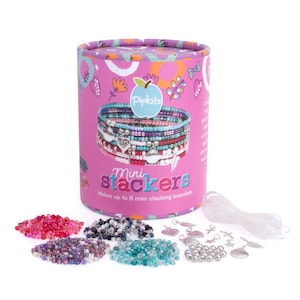 May include: A pink and purple container with the text "Pipkits Mini Stackers" and the words "Makes up to 8 mini stacking bracelets". The container is filled with colourful beads, silver charms, and clear elastic string.