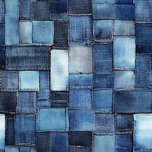 May include: A seamless pattern of various shades of blue denim fabric squares sewn together. The fabric has a worn and distressed look, creating a patchwork effect.