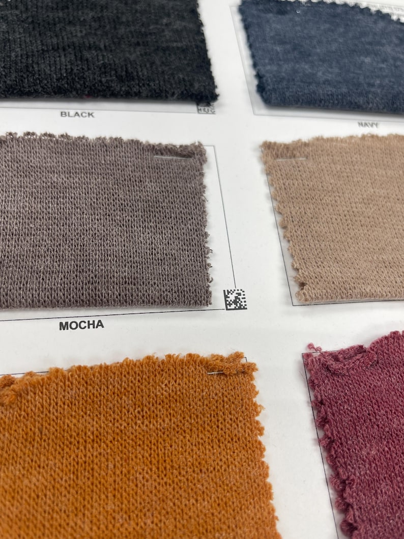 May include: Fabric swatches in black, navy, mocha, orange, and pink. The swatches are labeled with the color names.