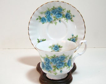 Royal Albert Bone China Cup And Saucer With Blue Roses
