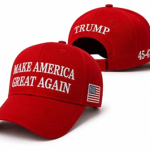 May include: A bright red baseball cap featuring the white embroidered text MAKE AMERICA GREAT AGAIN on the front, a small American flag patch on the side, and a second red cap behind it with TRUMP and 45-47 embroidered in white thread.