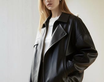 Oversized Black Leather Bomber Jacket: Vintage Style Sheepskin.