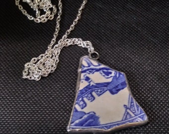 Vintage Pottery Pendant with Fisherman