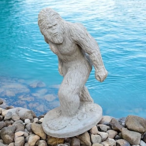 Detailed Bigfoot walking figure, Large snowman statue, Outdoor winter style decoration, Massive Bigfoot on base sculpture