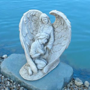 Angel protecting soldier statue, Lost soldier sculpture, Cement cherub with massive wings figurine, Outdoor backyard decoration