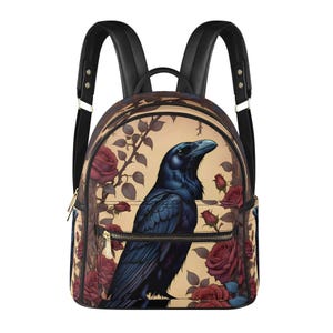 May include: A black leather backpack with adjustable straps. The backpack features a beige background with a black raven and red roses printed on it.