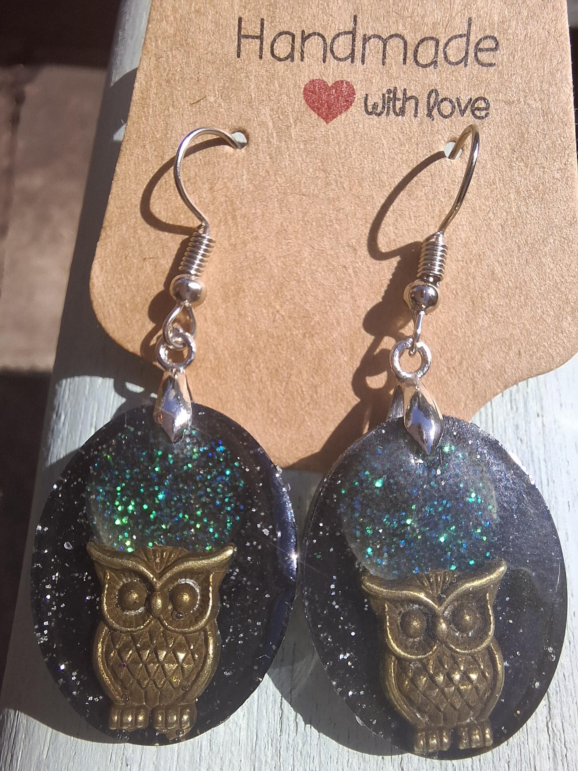 Handmade resin earrings with owl charm and sparkly moonlit sky.