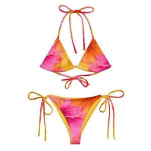 May include: A pink and yellow floral print bikini with adjustable straps. The top is a triangle style and the bottom is a cheeky style.