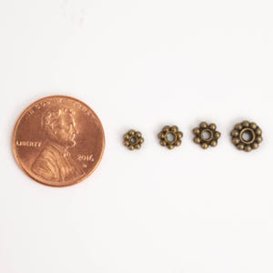 Cuentas espaciadoras de margaritas con acabado en cobre antiguo - 4 mm (300 unidades) - Lote al por mayor imagen 4