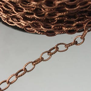 STRONg 19G New - 32 feet bulk chain, Antique Copper Plated Texture Drawn Cable Chain - 6.3x3.5mm Unsoldered - 6335DR-EX