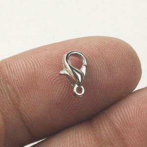Karabinerverschluss aus rhodinierter Zinklegierung 10 x 5 mm - LOB10 30 Stück - Großpackung Bild 1
