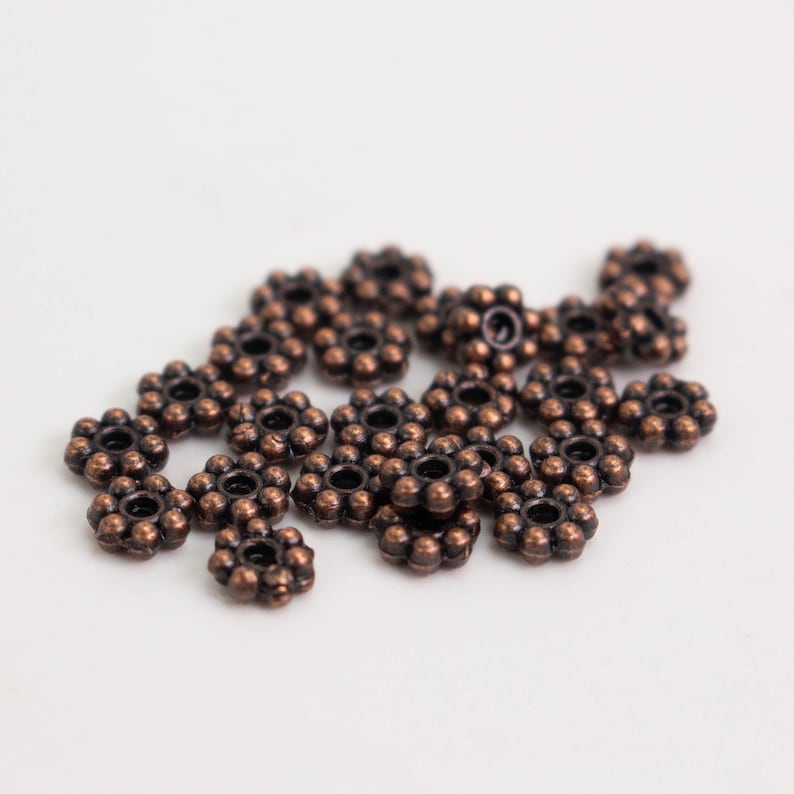 Cuentas espaciadoras de margaritas con acabado en cobre antiguo - 4 mm (300 unidades) - Lote al por mayor imagen 3