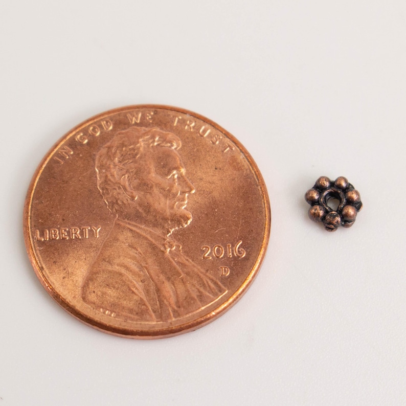 Cuentas espaciadoras de margaritas con acabado en cobre antiguo - 4 mm (300 unidades) - Lote al por mayor imagen 2
