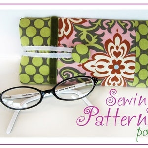 May include: A sewing pattern for a glasses case. The case is made of fabric with a green and brown floral pattern. The pattern is available as a PDF download.