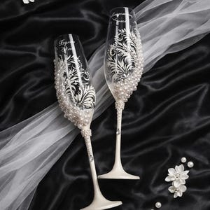 engraved wedding champagne glasses, pearl wedding flutes, mr and mrs glasses, hand painted champagne flutes, wedding cake knife server set, pearl handle cake server, bridal toast set, wedding glassware set, floral engraved glasses, bride groom toast flutes, wedding gift set, ivory pearl wedding decor, cake cutting set wedding, custom wedding glasses, elegant pearl flutes