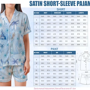 May include: Light blue satin short-sleeve pajama set featuring a print of a castle, snowflakes, and bows. The set includes a button-down shirt and shorts. Measurements are provided in inches and centimeters.