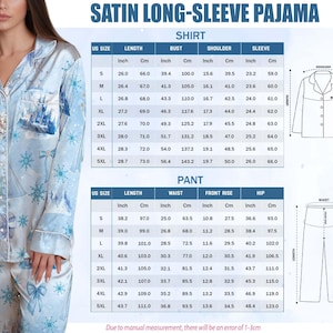 May include: Light blue satin long-sleeve pajama set with a winter castle and snowflake pattern. The set includes a button-down shirt and pants. Measurements chart in inches and centimeters is included.