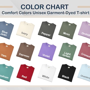 May include: A colour chart presents a range of Comfort Colors Unisex Garment-Dyed T-shirts. The shirts are arranged to display colours such as Blue Jean, Ivory, Pepper, Moss, Orchid, Yam, Espresso, Violet, Light Green, Crimson, Seafoam, Red, White, Black, and Chambray.