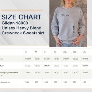 May include: A size chart for a Gildan 18000 Unisex Heavy Blend Crewneck Sweatshirt. The chart shows measurements in inches for width, length, and sleeve length, ranging from size S to 5XL. A person is wearing a gray sweatshirt.