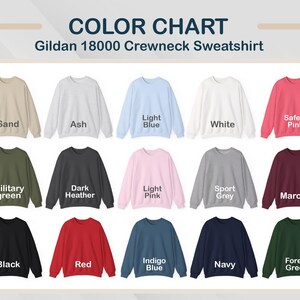 May include: Color chart of Gildan 18000 crewneck sweatshirts in various colors, including sand, ash, light blue, white, safety pink, military green, dark heather, light pink, sport grey, maroon, black, red, indigo blue, navy, and forest green.