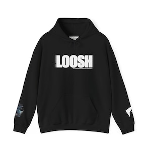 May include: Black hooded sweatshirt with the word "LOOSH" in large white capital letters across the chest. The text "THE LACKEYS" is printed vertically on the left side of the word "LOOSH". The text "HYPERDIMENSIONAL ENERGY" is printed below the word "LOOSH".