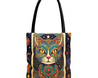 May include: A colorful tote bag with a psychedelic cat design. The cat's face is surrounded by stars, moons, and suns. The bag is made of canvas and has a black handle.