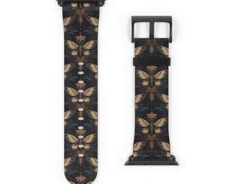 May include: Black Apple Watch band with a repeating pattern of gold butterflies on a dark blue background.