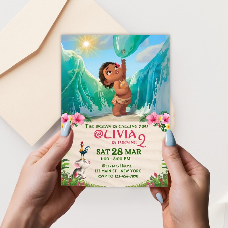 A square Baby Moana birthday invitation card held in hands, showing a toddler girl character standing on the beach with waves and sun, with editable text including name, age, and party details.