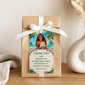 Gift box wrapped with a ribbon and a Moana-themed thank you tag featuring a tropical beach scene and a personalized thank you message.