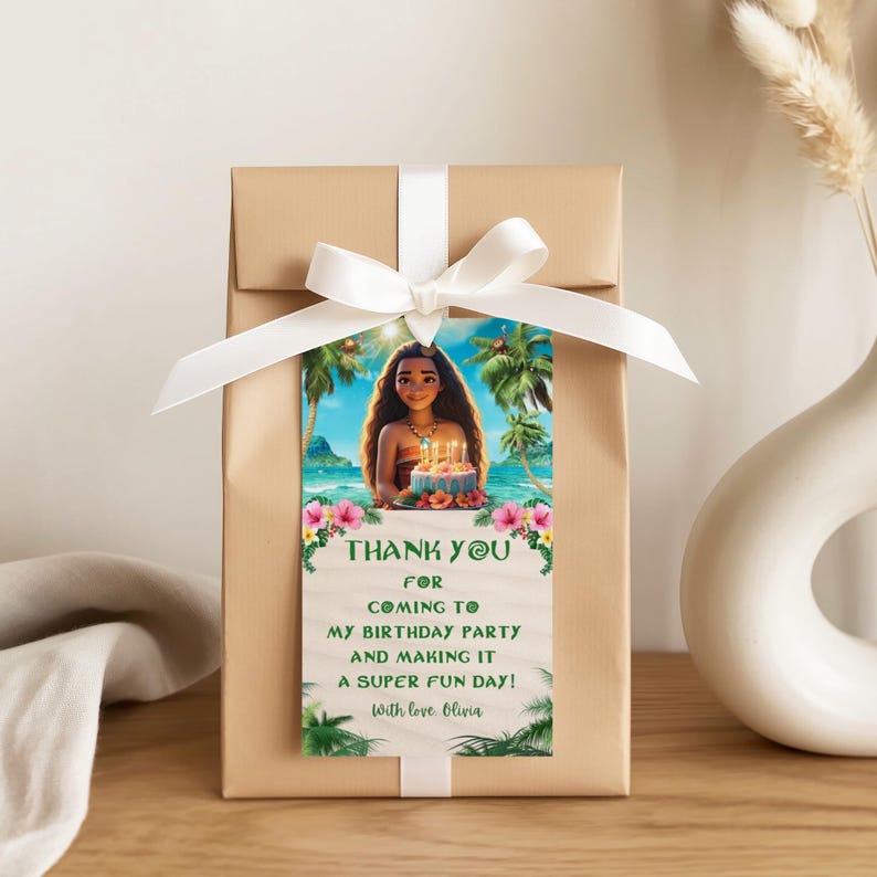 Gift box wrapped with a ribbon and a Moana-themed thank you tag featuring a tropical beach scene and a personalized thank you message.