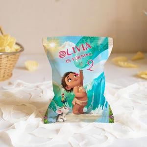 A chip bag mockup with Moana design, showing a filled snack bag standing upright on a soft background.