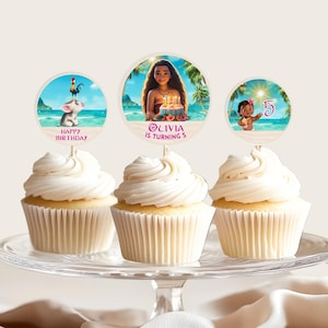 Cupcake toppers placed on frosted cupcakes showing three different round designs with tropical characters and birthday elements.