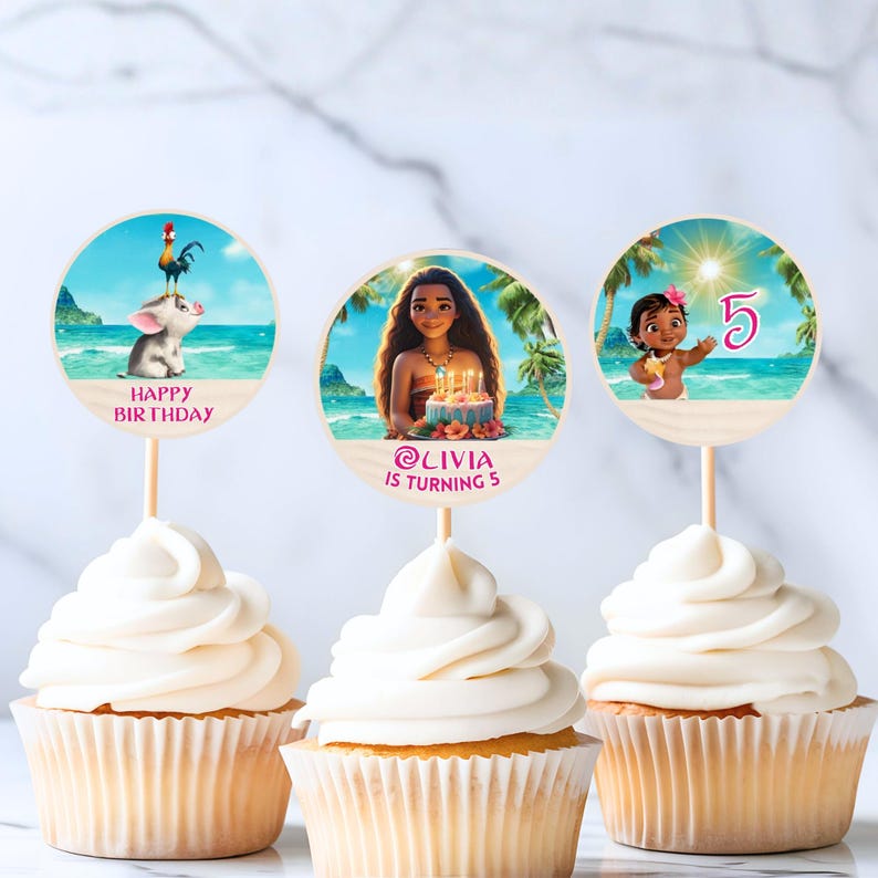 Three cupcakes with white frosting topped with round Moana-themed toppers featuring a beach scene, characters, and a customizable name and age.