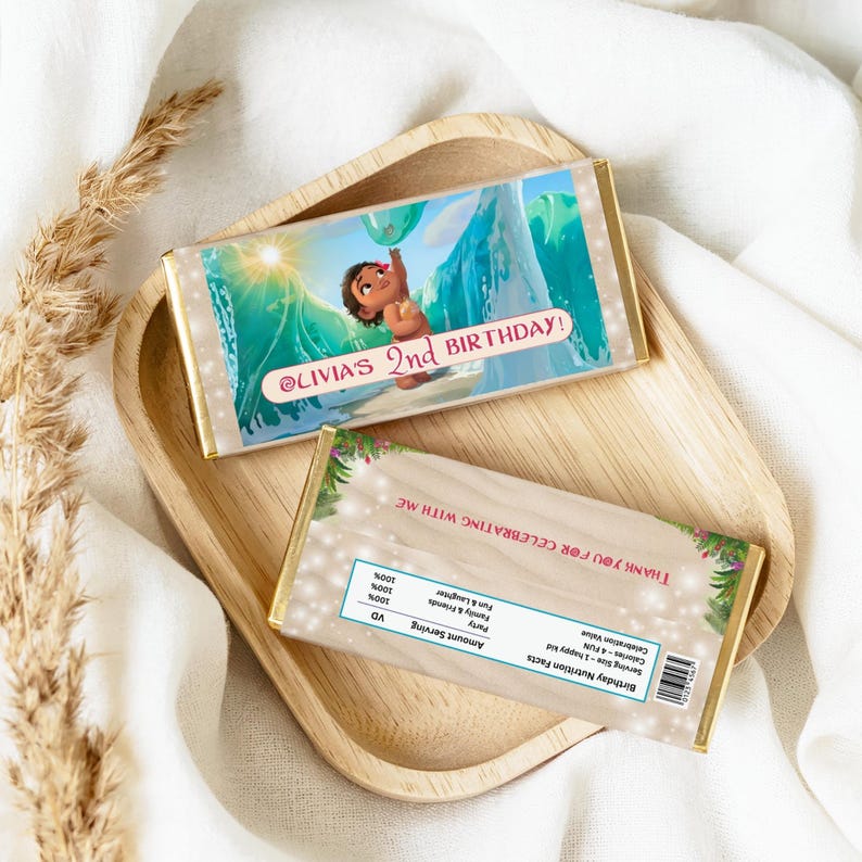 Chocolate bar wrappers wrapped around candy bars, featuring Moana ocean scene and birthday text.