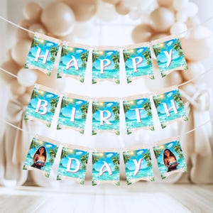 A “Happy Birthday” banner made of small rectangular flags with ocean and palm tree background hanging on a string.