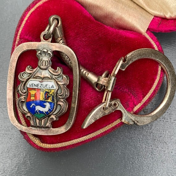 Vintage Silver Enamel Travel Shield Key Chain .