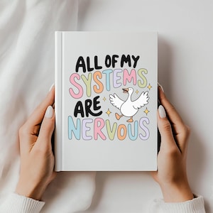 Puede incluir: Una libreta blanca con el texto "All of my systems are nervous" en letras de colores. Un ganso de dibujos animados está en el medio del texto.