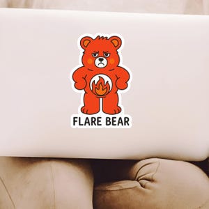 May include: A red cartoon bear sticker with a flame design on its belly and the words "FLARE BEAR" in a white font. The bear has an angry expression and is standing upright.